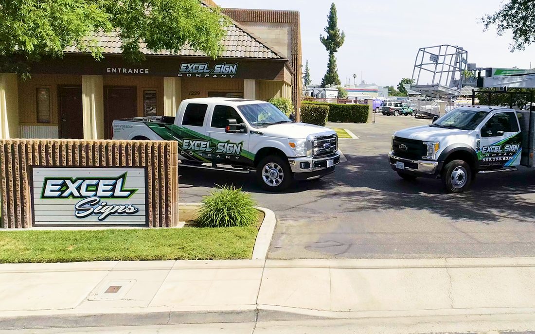 Excel Sign Company shop and wrapped work trucks in Clovis, CA